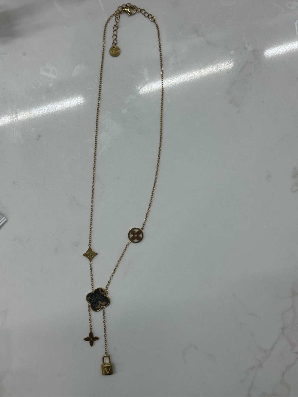 Gold-tone Women’s Pendant Necklace with Clover and Lock Charms